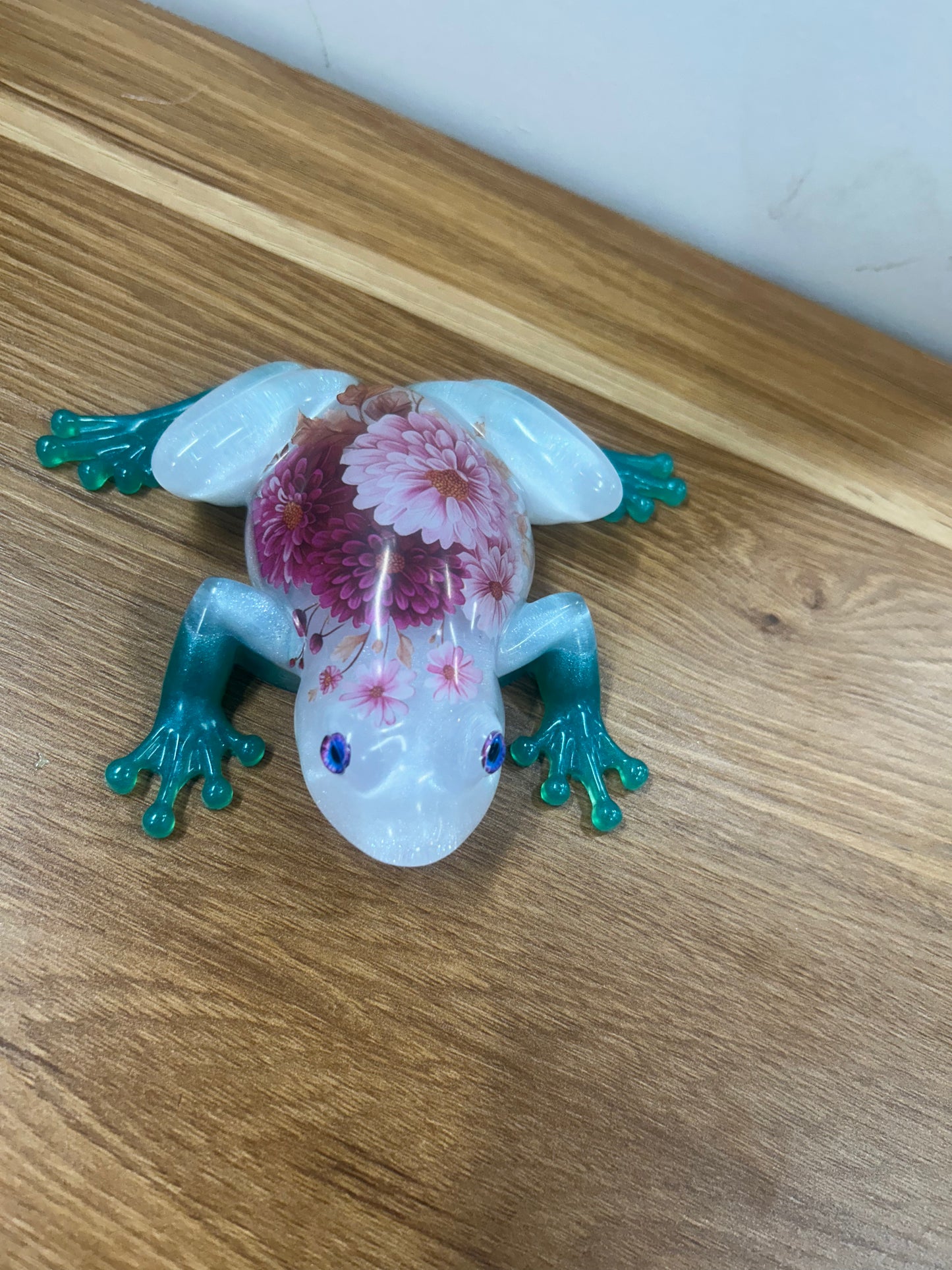 Pink flowers teal feet Frog
